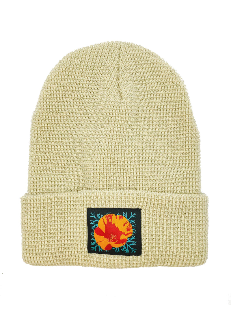 CULK | California Poppy Beanie, Cream | Flat lay of cuffed waffle knit beanie with patch on front of cuff